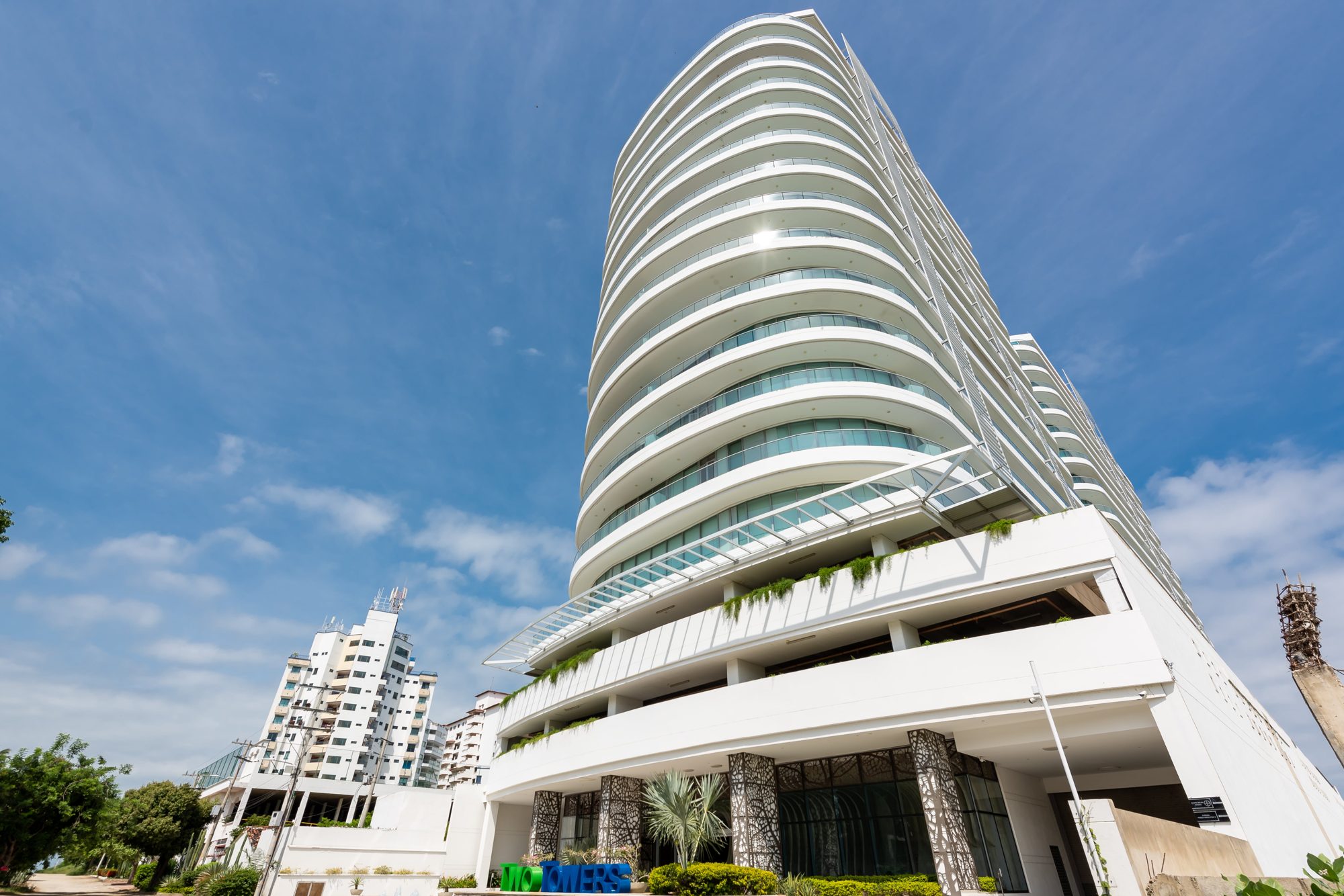 Two Tower, Santa Marta: a curved white tower with glass balconies